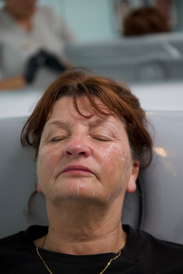 A client relaxing during a facial treatment